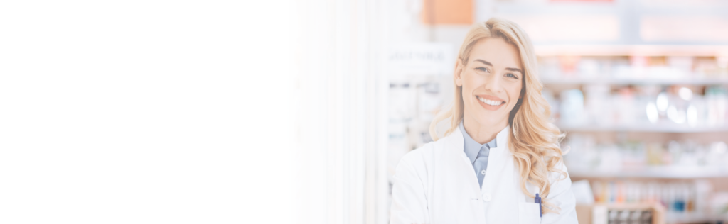 Smiling female pharmacist looking at camera