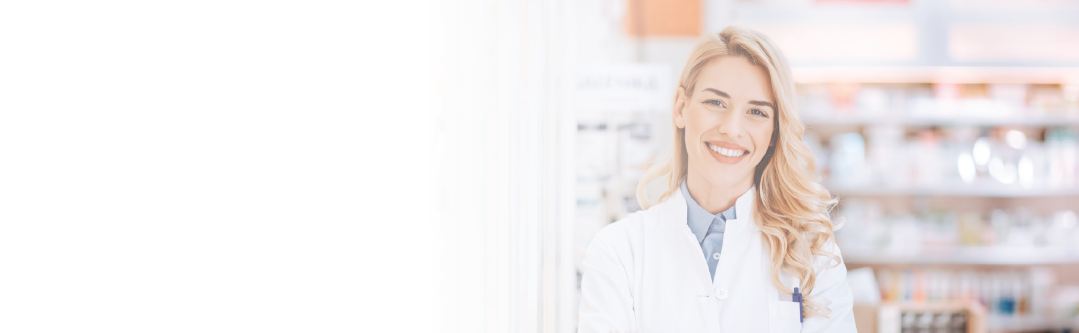 Smiling female pharmacist looking at camera